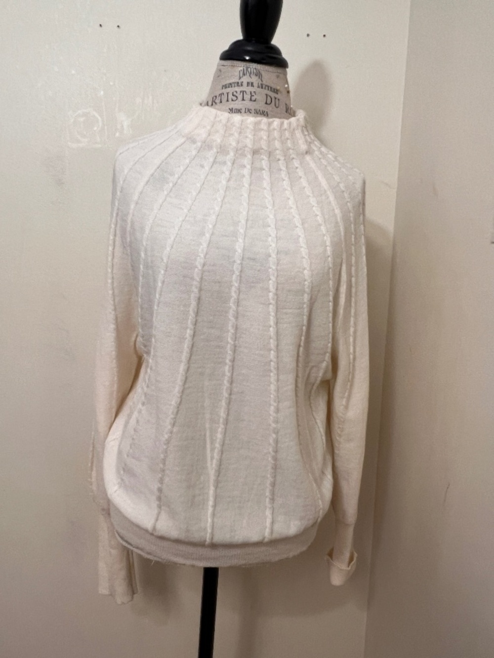 Marella a cream-colored wool sweater with vertical cable-knit pattern